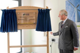 Prince Charles unveils a plaque at the opening of the Barkip AD facility